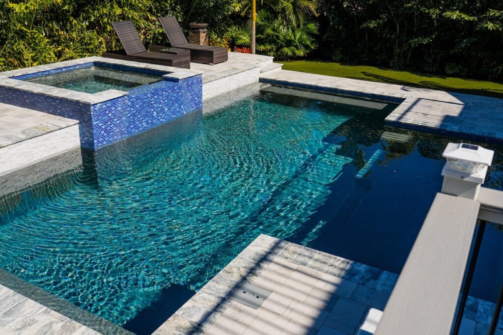 Pool Remodeling project in El Dorado Hills β Remodeled pool with raised tile spa and waterfall feature