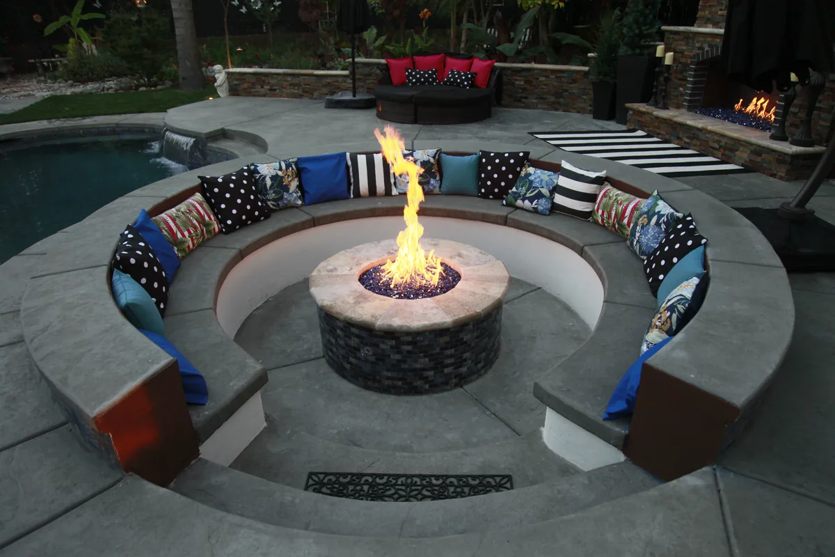 Circular fire pit curved bench seating by Pinnacle Pools and Landscape, Sacramento CA