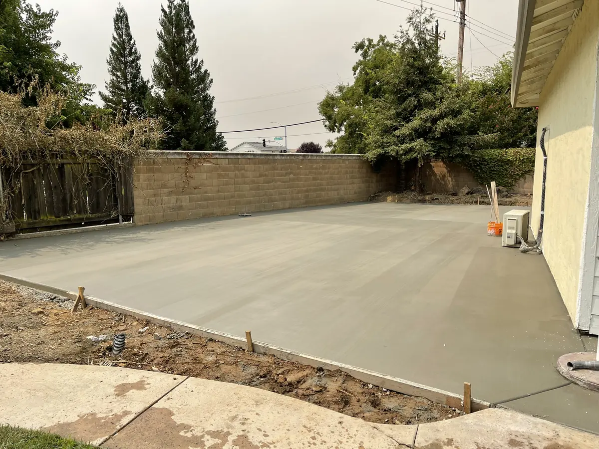 Concrete patio pour backyard by Pinnacle Pools and Landscape, Sacramento CA