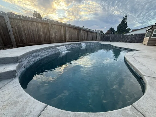 Freeform pool broom finish deck by Pinnacle Pools and Landscape, Sacramento CA