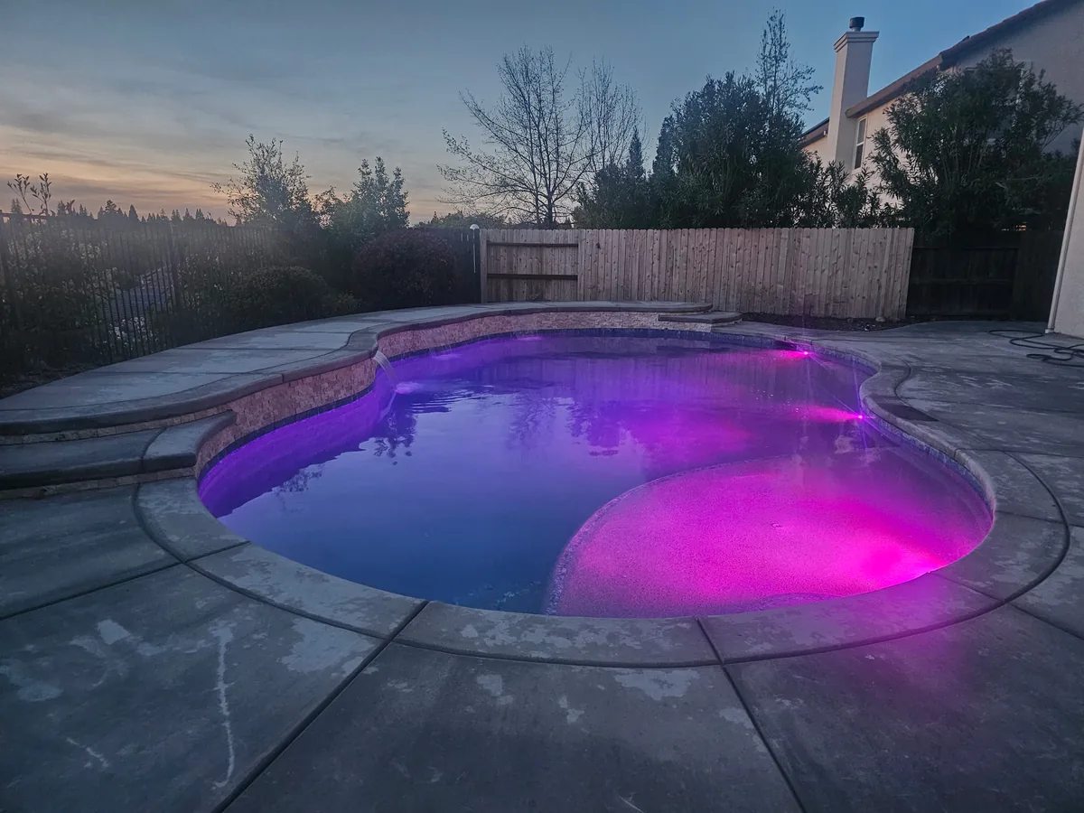 Freeform pool color led lighting purple by Pinnacle Pools and Landscape, Sacramento CA
