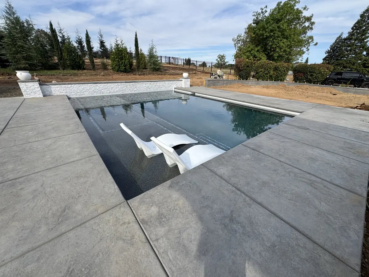 Geometric pool dark finish lounge chairs by Pinnacle Pools and Landscape, Sacramento CA