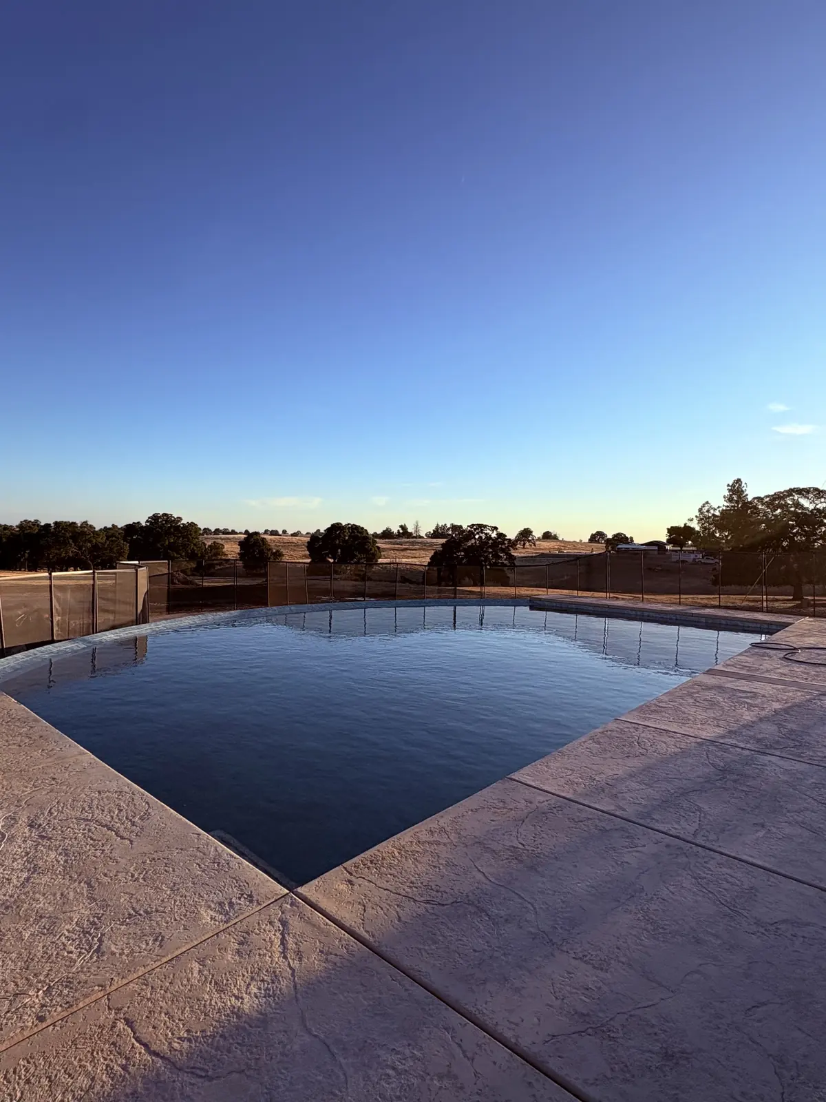 Geometric pool dusk stamped concrete by Pinnacle Pools and Landscape, Sacramento CA
