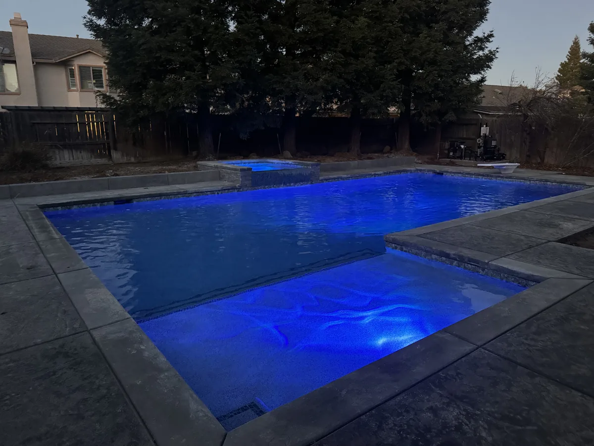 Geometric pool spa blue led night by Pinnacle Pools and Landscape, Sacramento CA