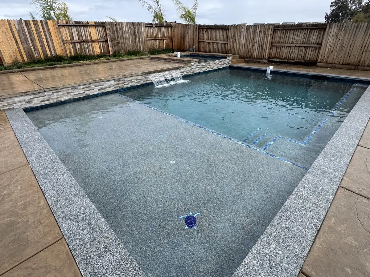 Geometric pool spa sheer descent waterfall by Pinnacle Pools and Landscape, Sacramento CA