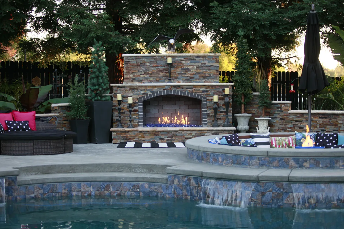 Outdoor fireplace fire pit lounge dusk by Pinnacle Pools and Landscape, Sacramento CA