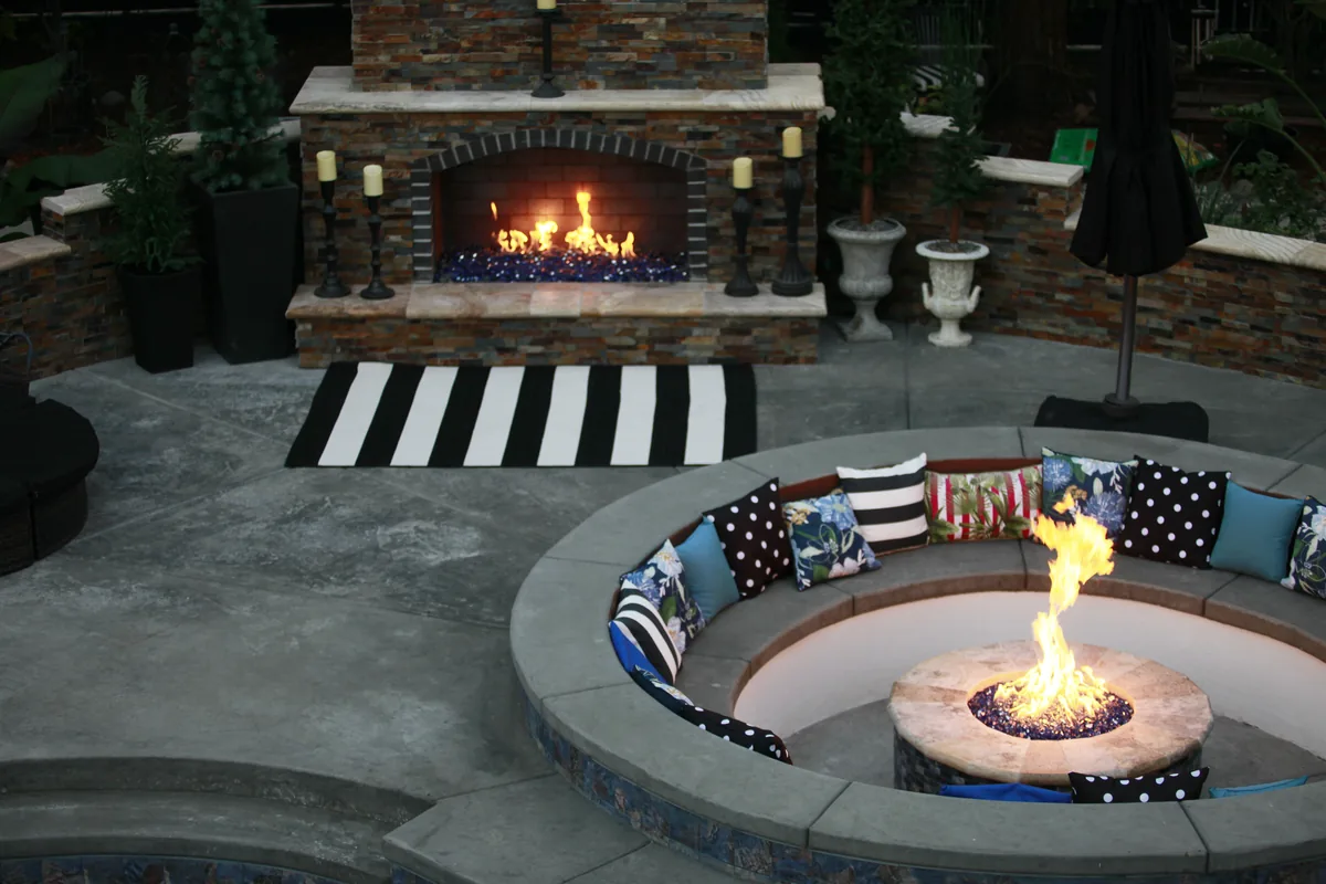 Outdoor fireplace fire pit patio night by Pinnacle Pools and Landscape, Sacramento CA
