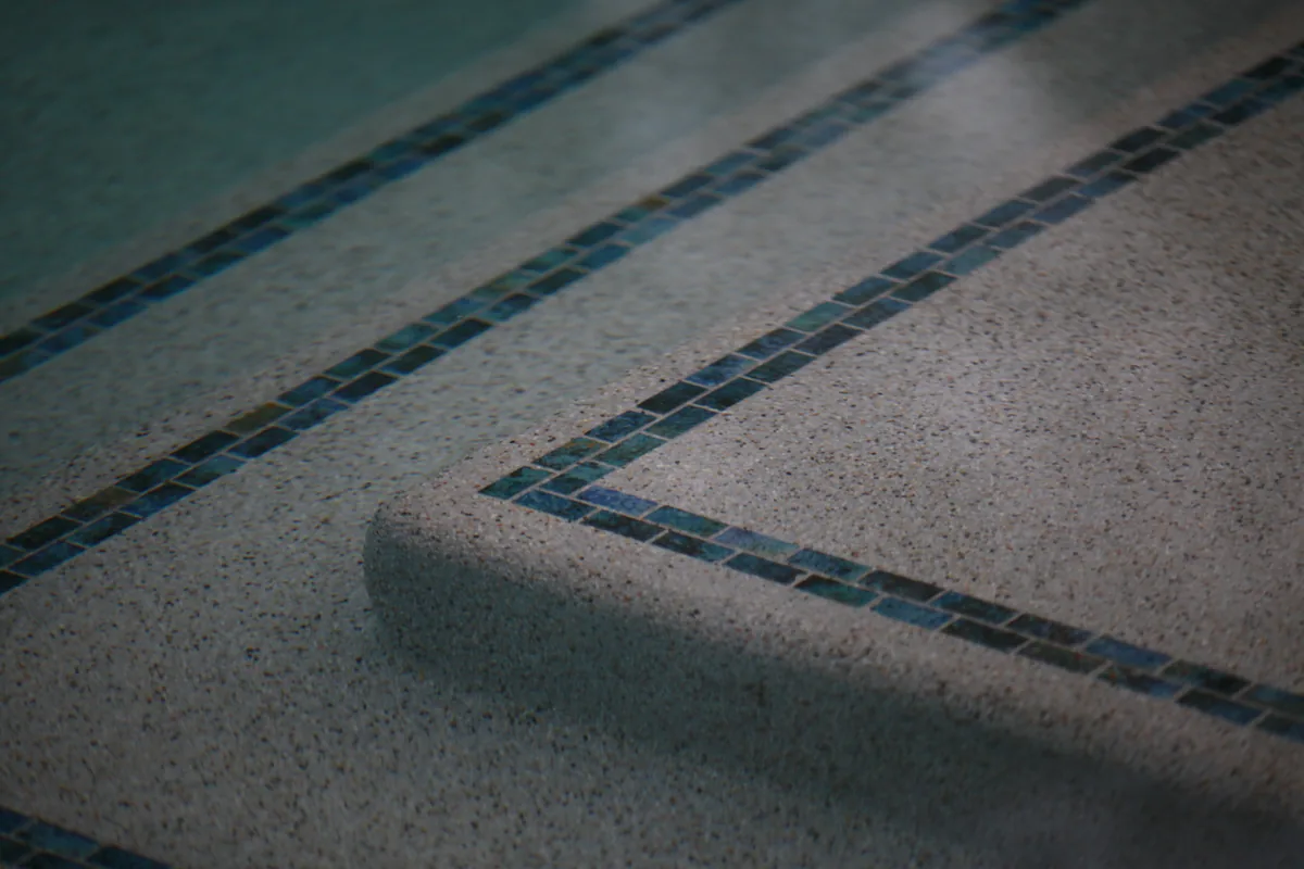 Pool coping tile detail closeup by Pinnacle Pools and Landscape, Sacramento CA