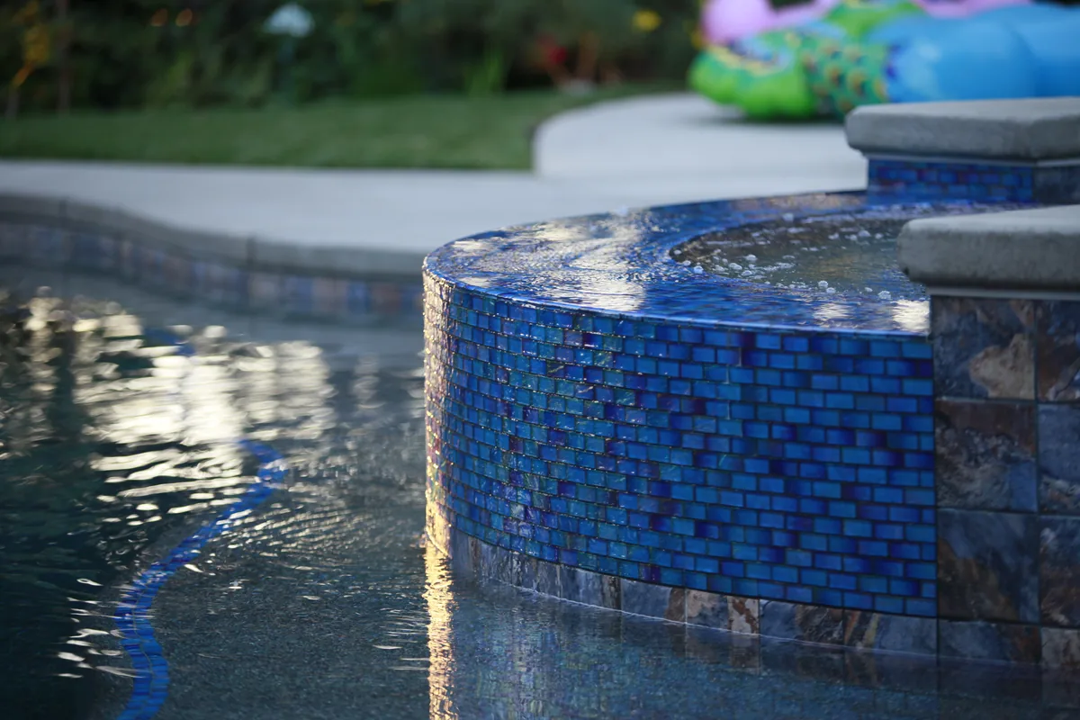 Pool glass mosaic tile raised wall by Pinnacle Pools and Landscape, Sacramento CA