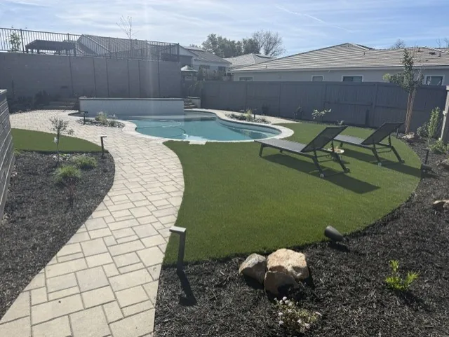 Pool landscape paver walkway turf by Pinnacle Pools and Landscape, Sacramento CA