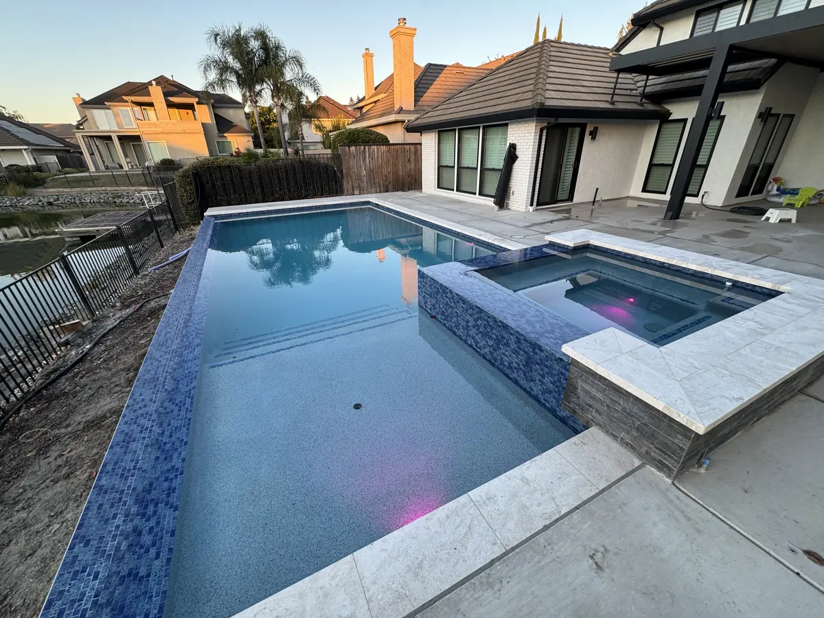 Pool raised spa glass tile hillside view by Pinnacle Pools and Landscape, Sacramento CA