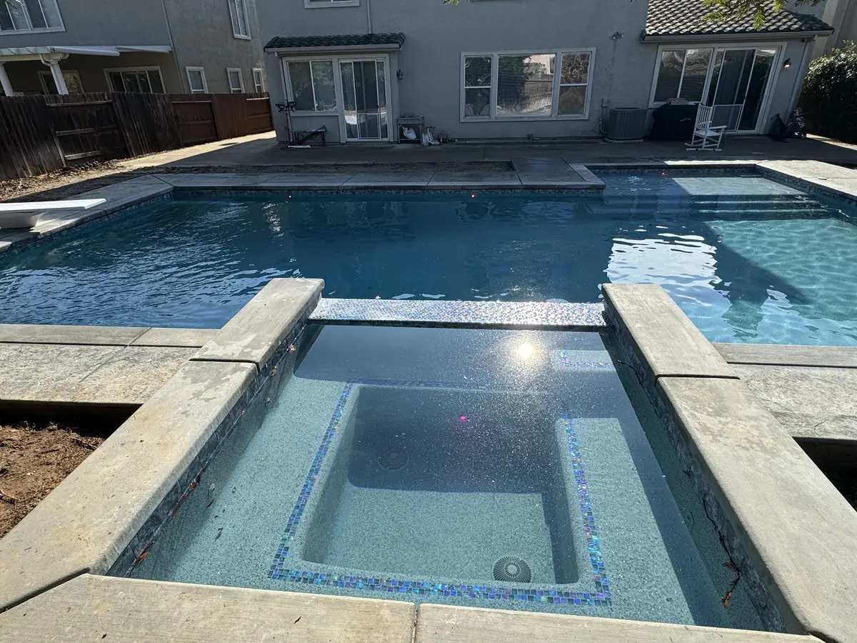 Pool raised spa spillway glass tile by Pinnacle Pools and Landscape, Sacramento CA