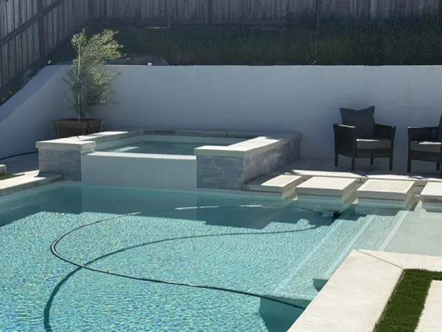 Pool raised spa tanning ledge turf by Pinnacle Pools and Landscape, Sacramento CA