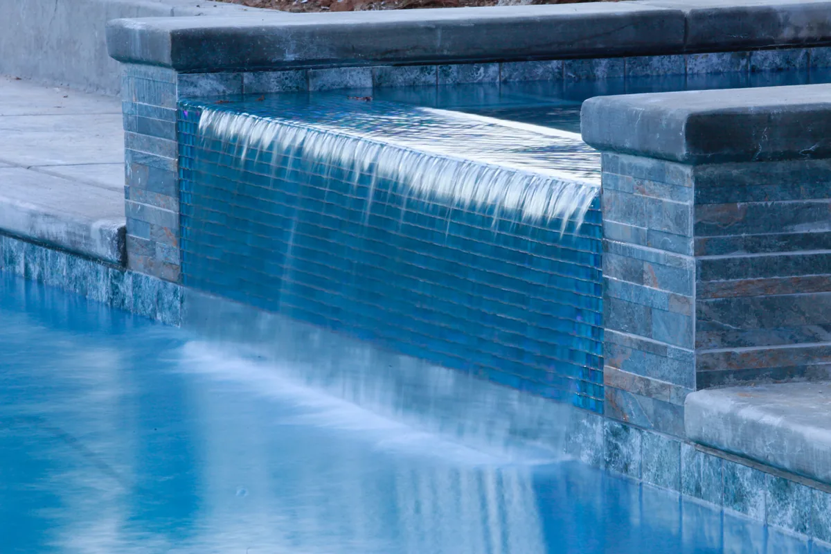 Pool sheer descent waterfall blue tile by Pinnacle Pools and Landscape, Sacramento CA