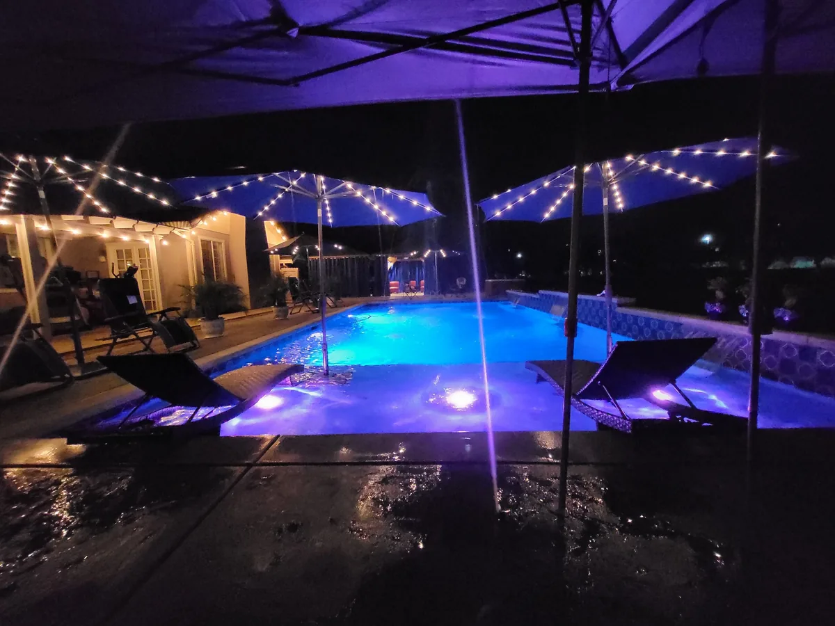 Pool spa string lights evening entertaining by Pinnacle Pools and Landscape, Sacramento CA