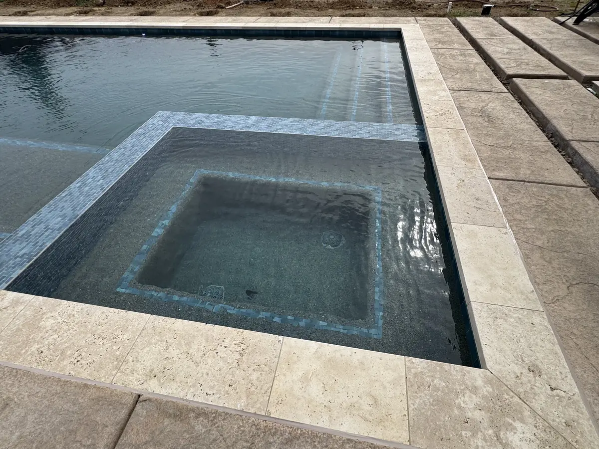 Pool spa travertine deck glass tile by Pinnacle Pools and Landscape, Sacramento CA