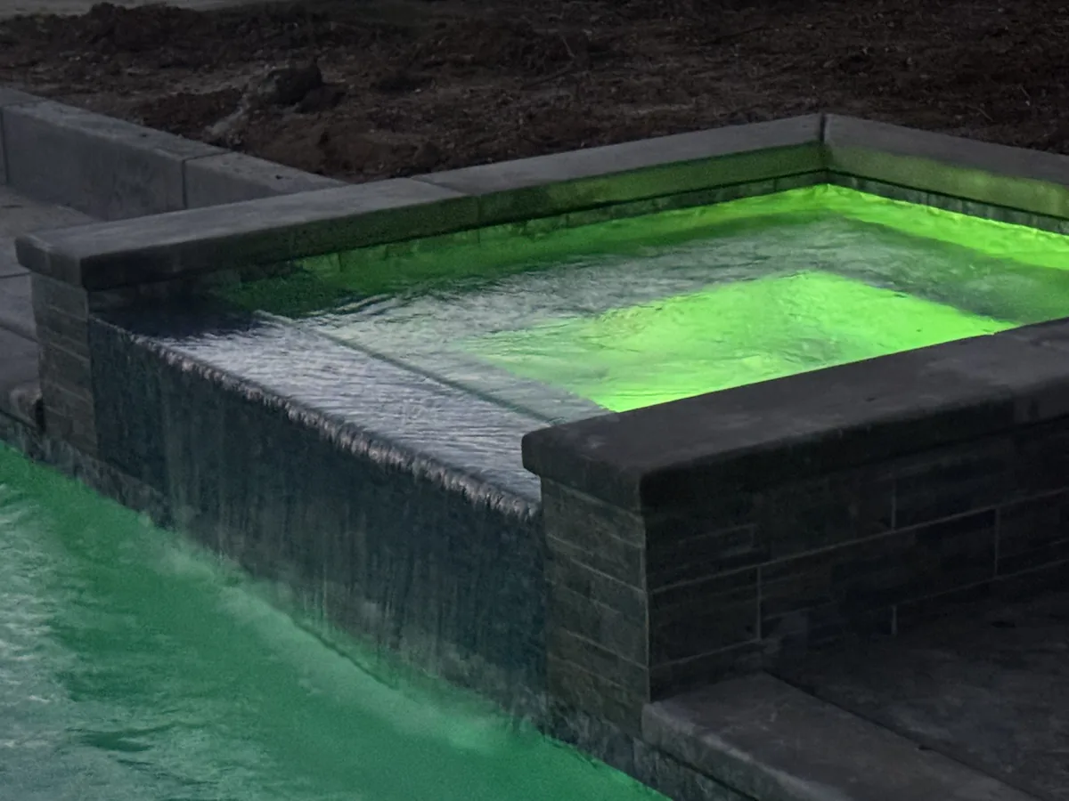 Raised spa spillway green led lighting by Pinnacle Pools and Landscape, Sacramento CA