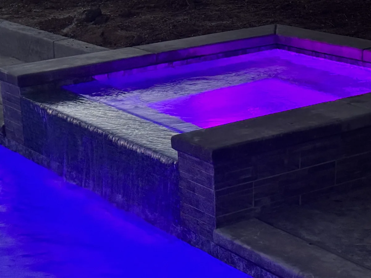Raised spa spillway purple led lighting by Pinnacle Pools and Landscape, Sacramento CA