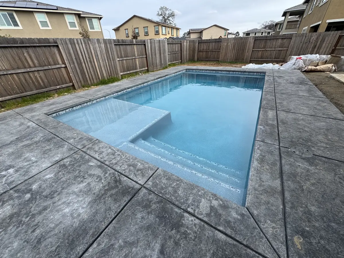 Rectangular pool baja shelf deck by Pinnacle Pools and Landscape, Sacramento CA