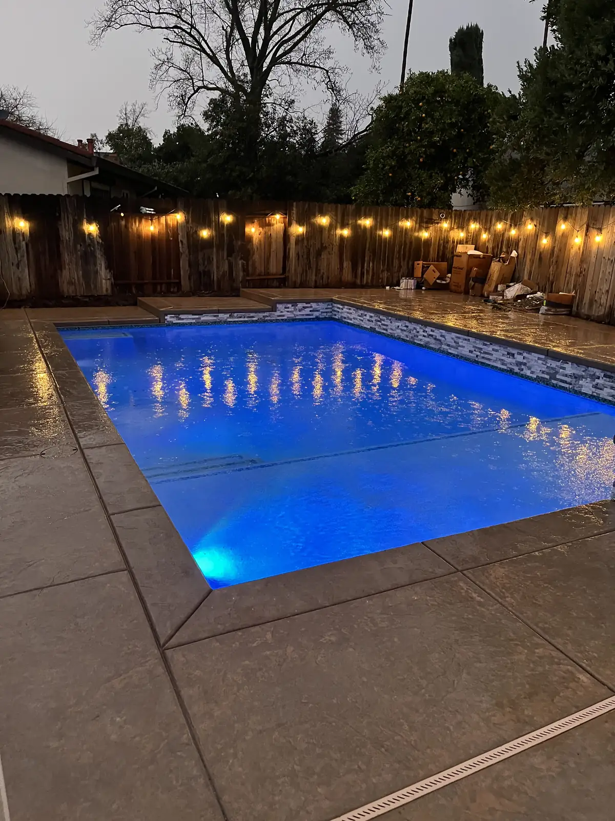 Rectangular pool led lighting night by Pinnacle Pools and Landscape, Sacramento CA