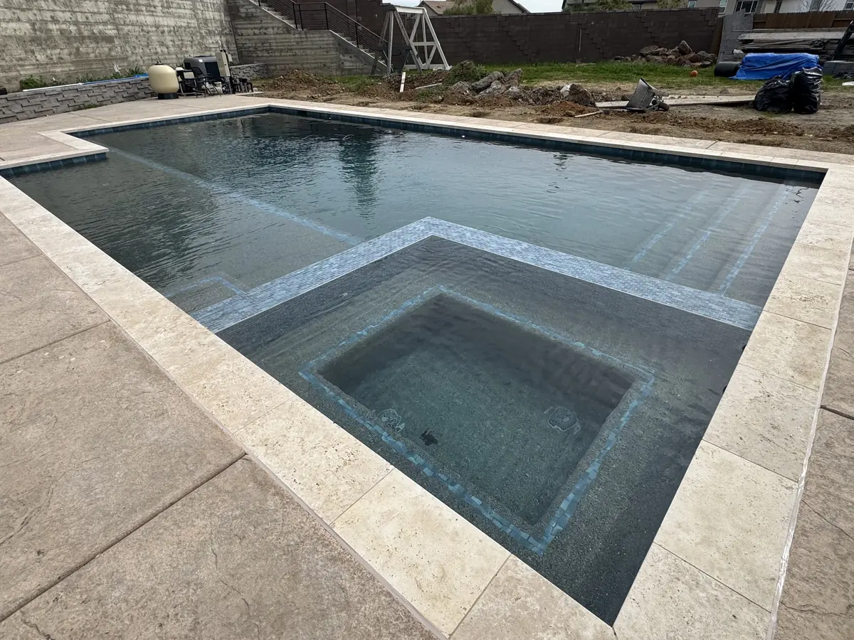 Rectangular pool spa travertine coping by Pinnacle Pools and Landscape, Sacramento CA