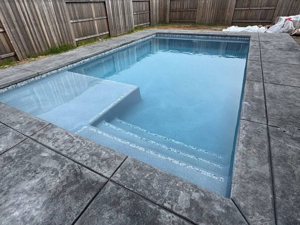 Rectangular pool tanning ledge stamped concrete by Pinnacle Pools and Landscape, Sacramento CA