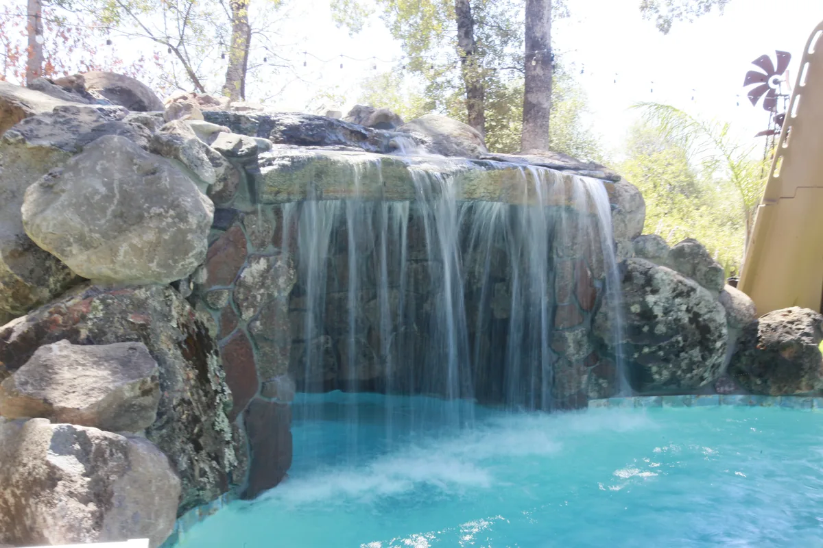 Rock waterfall grotto pool by Pinnacle Pools and Landscape, Sacramento CA